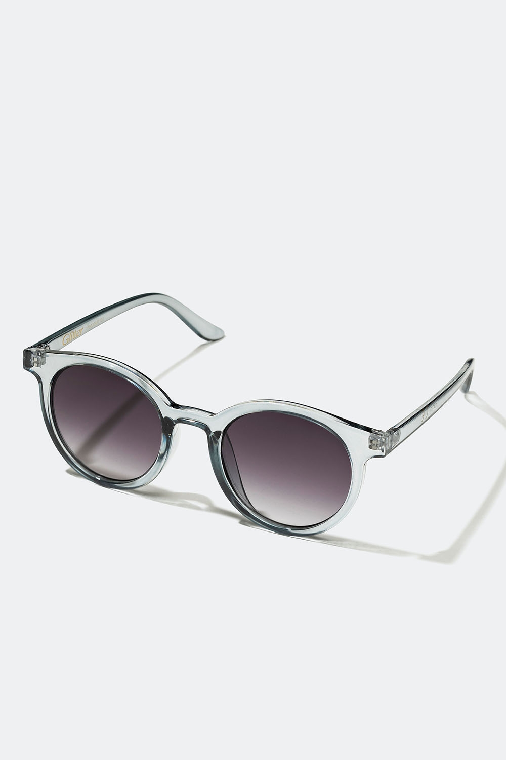 Runde solbriller med gennemsigtigt lysegråt stel i gruppen Accessories / Solbriller hos Glitter (176000987100)