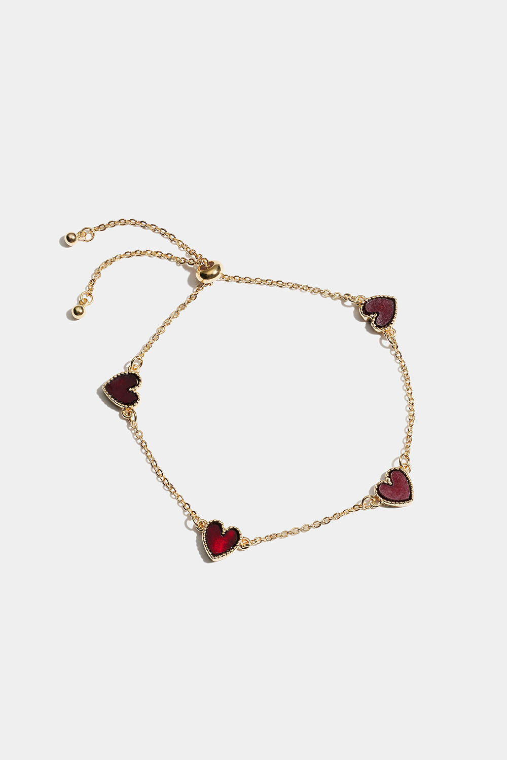 Guldfarvet armbånd med røde hjerter i gruppen Store week / hos Glitter (251001656302)
