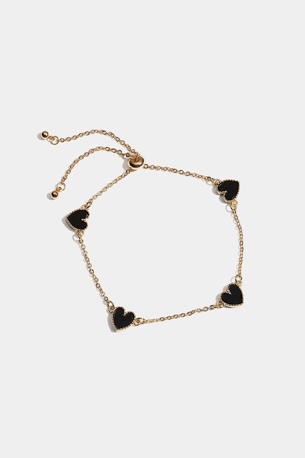 Guldfarvet armbånd med sorte hjerter i gruppen Store week / hos Glitter (251001659002)