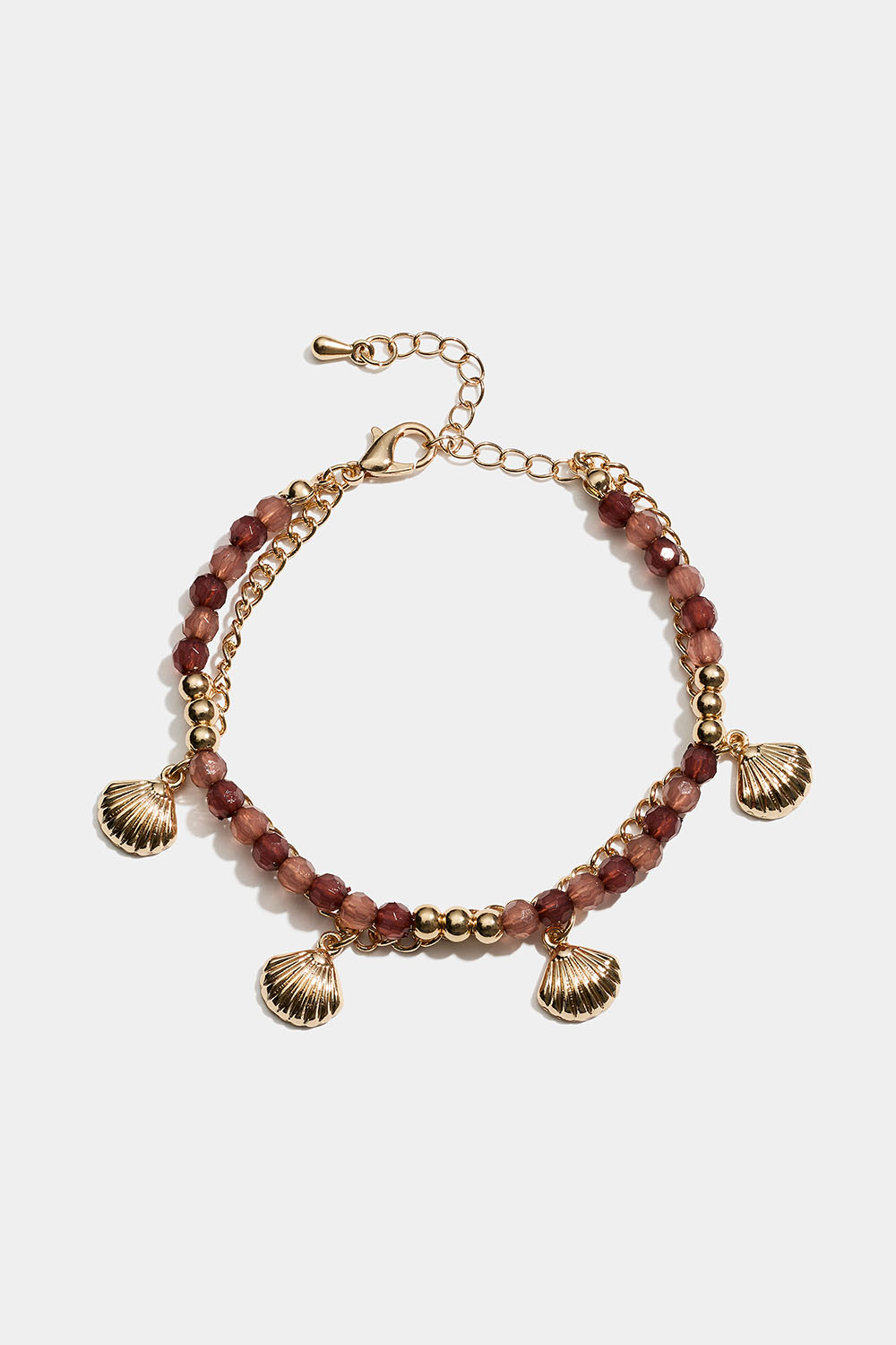 Dobbelt armbånd med brune perler og muslingeskaller i gruppen Smykker / Armbånd hos Glitter (251002118002)