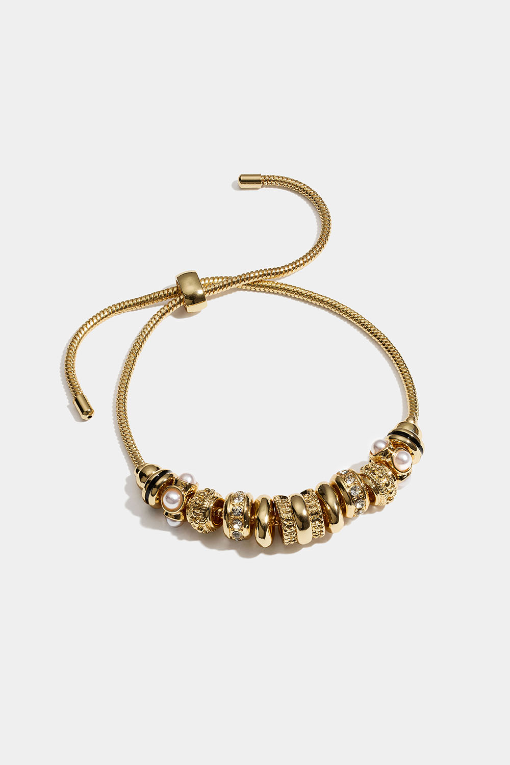 Guldfarvet armbånd med runde charms med glassten og perler i gruppen Smykker / Armbånd hos Glitter (251002322002)