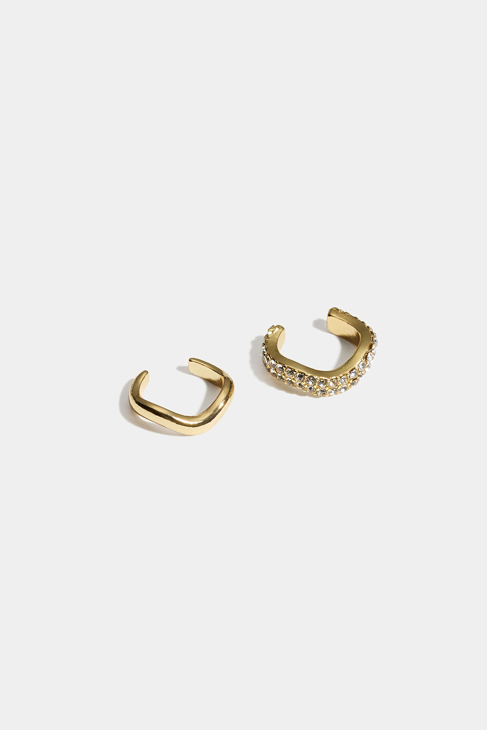 Bølgede guldfarvede ear cuffs med glassten, 2-pak i gruppen Smykker / Øreringe / Ear cuffs hos Glitter (253011782002)
