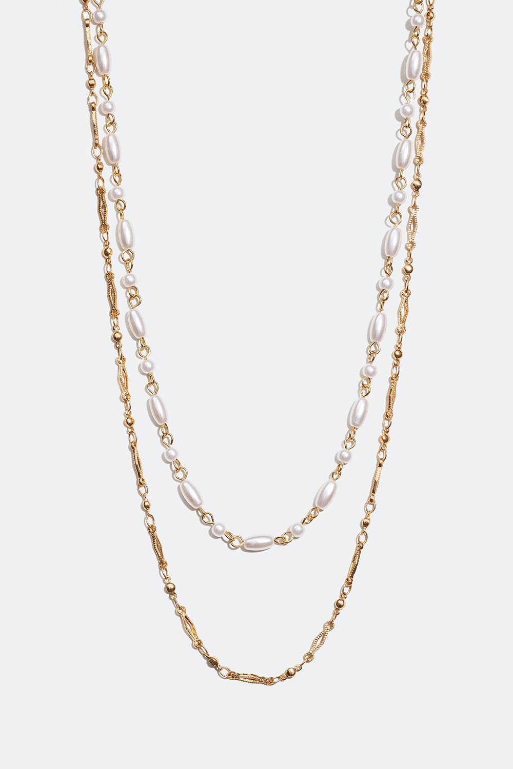 Guldfarvet dobbelt halskæde med ovale og runde perler i gruppen Smykker / Halskæder hos Glitter (254001402002)