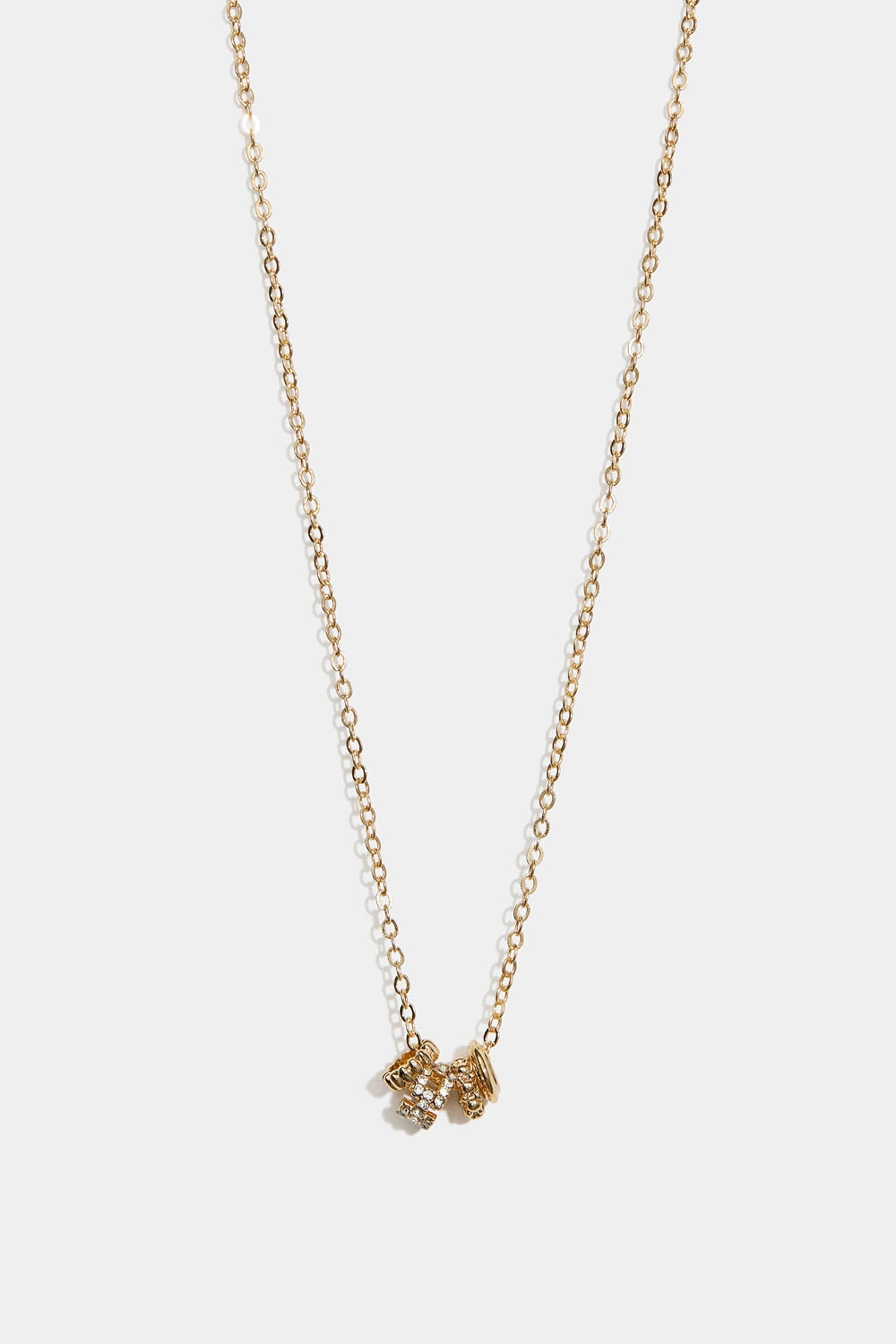 Guldfarvet halskæde med fire runde charms i gruppen Store week / hos Glitter (254002252002)