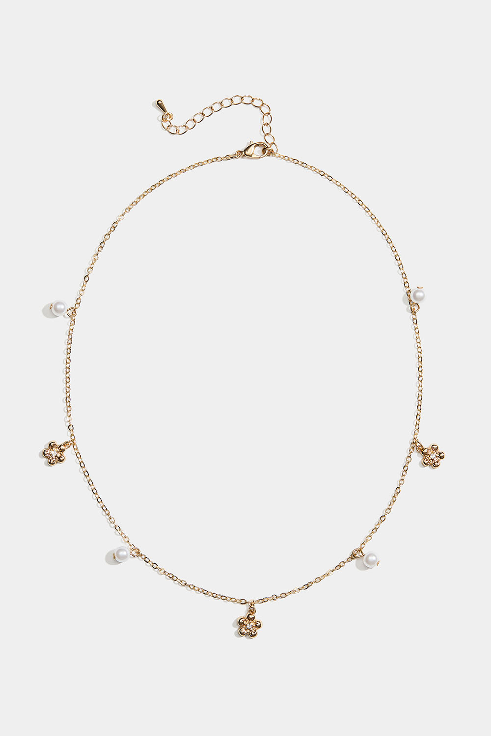Guldfarvet halskæde med blomster og hvide perler i gruppen Store week / hos Glitter (254002572002)