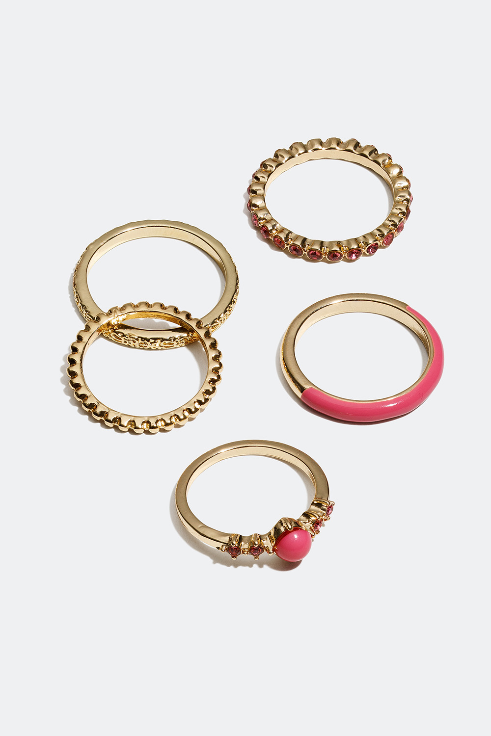 Guldfarvede ringe med detaljer i rosa, 5-pak i gruppen Smykker / Ringe / Flerpak hos Glitter (256000625)