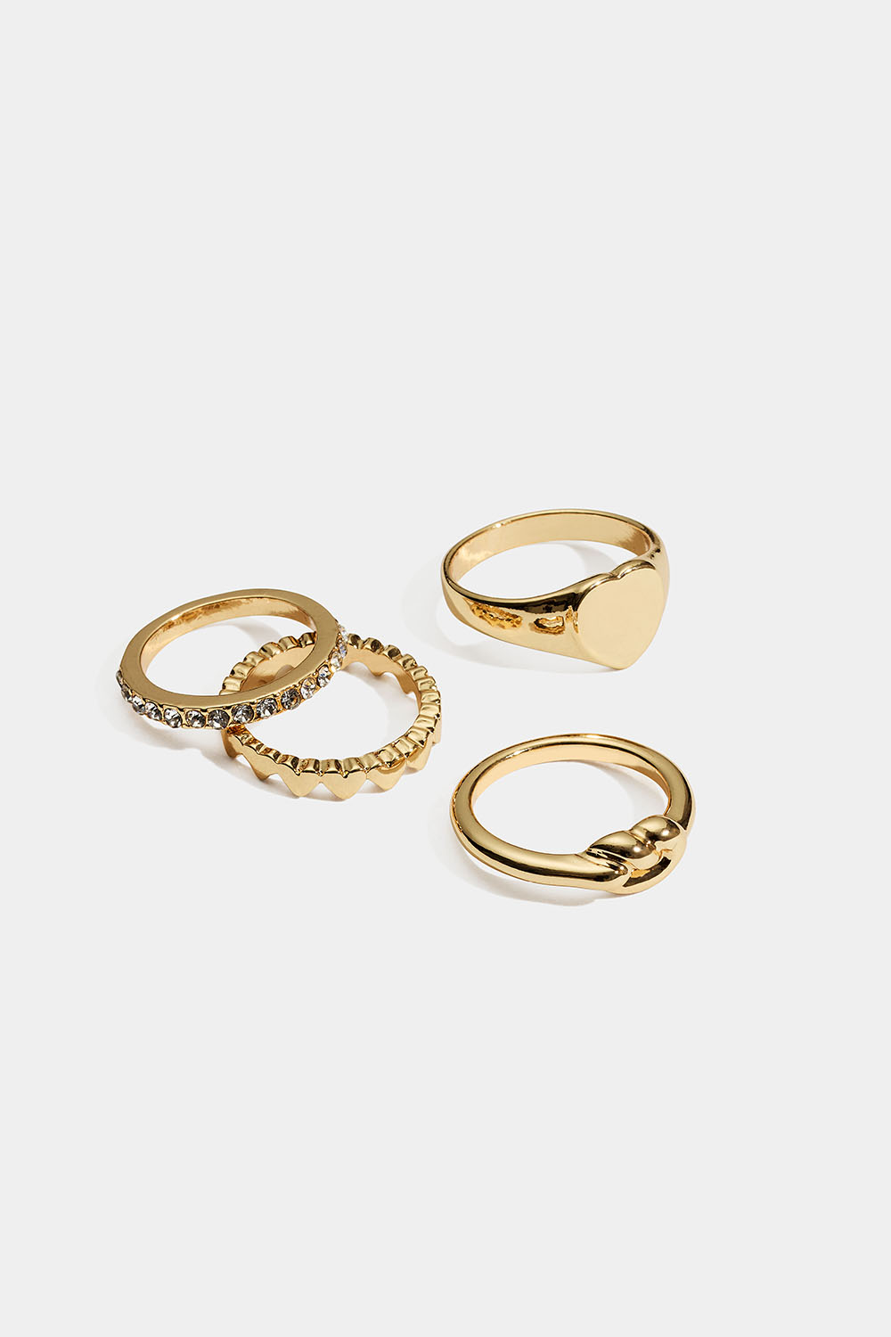 Guldfarvede ringe med hjerte, knude og glassten, 4-pak i gruppen Smykker / Ringe / Flerpak hos Glitter (2560020420)