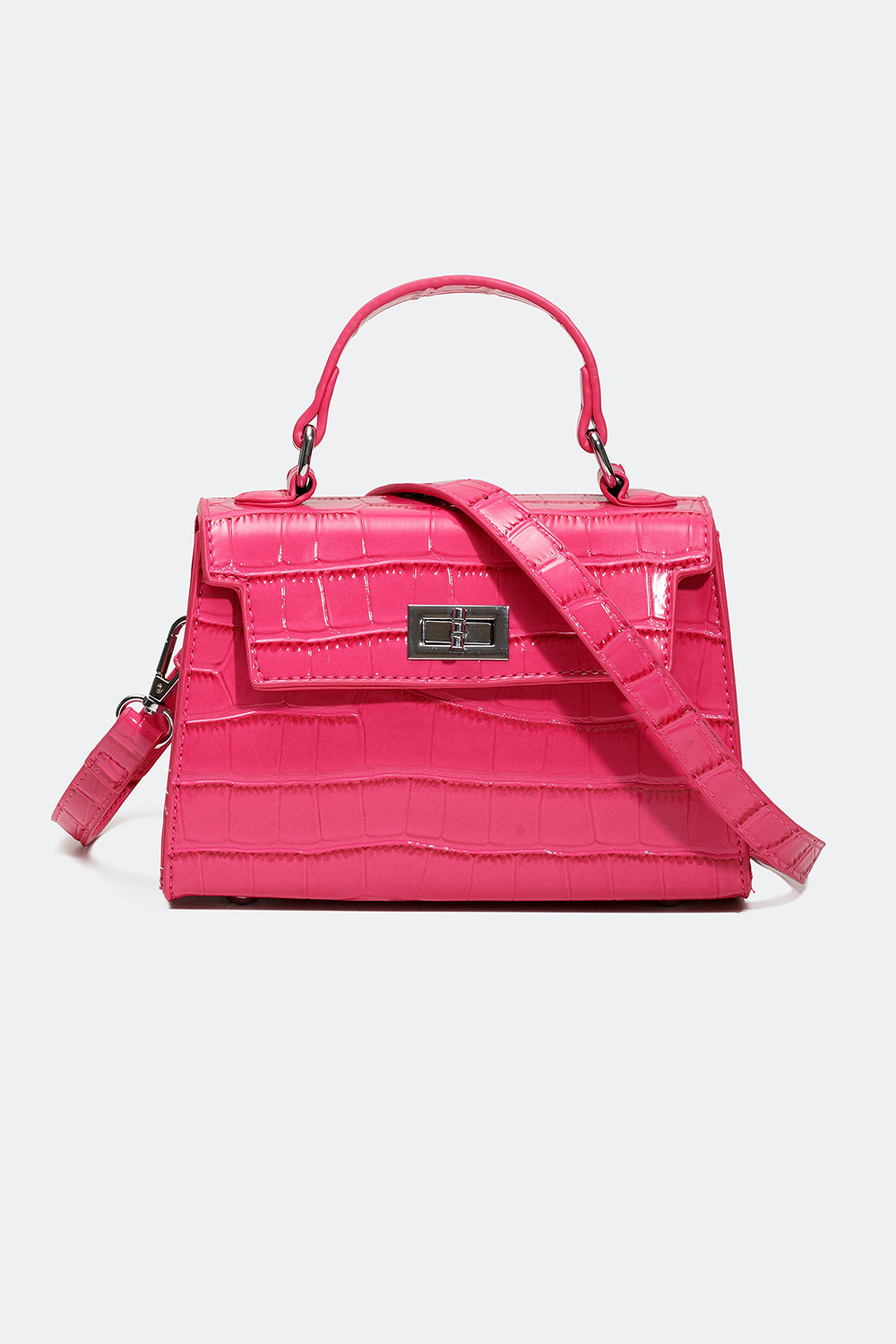 Lille lyserød håndtaske med krokodillemønster