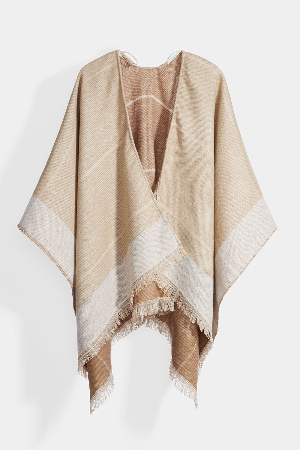 Beige poncho med frynser