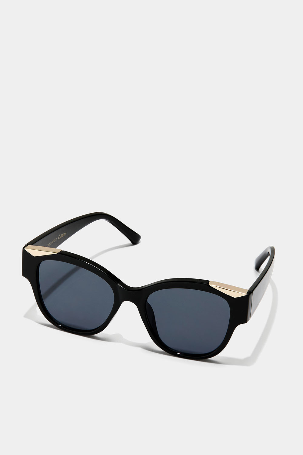 Solbriller med guldfarvede detaljer på stellet