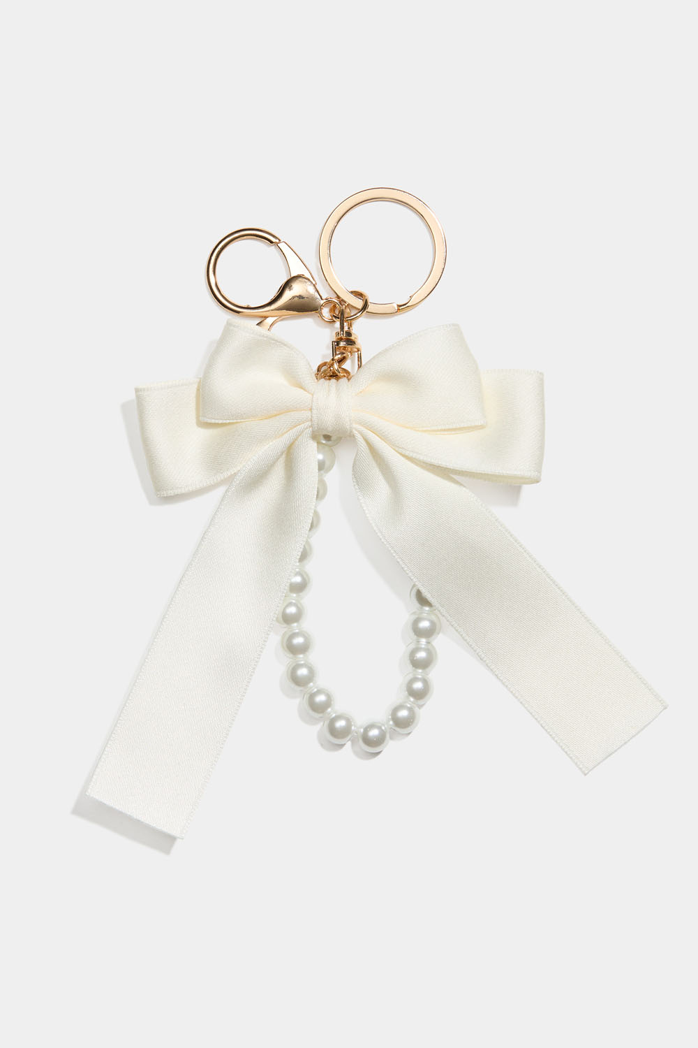 Taskepynt med hvid sløjfe og perlebånd