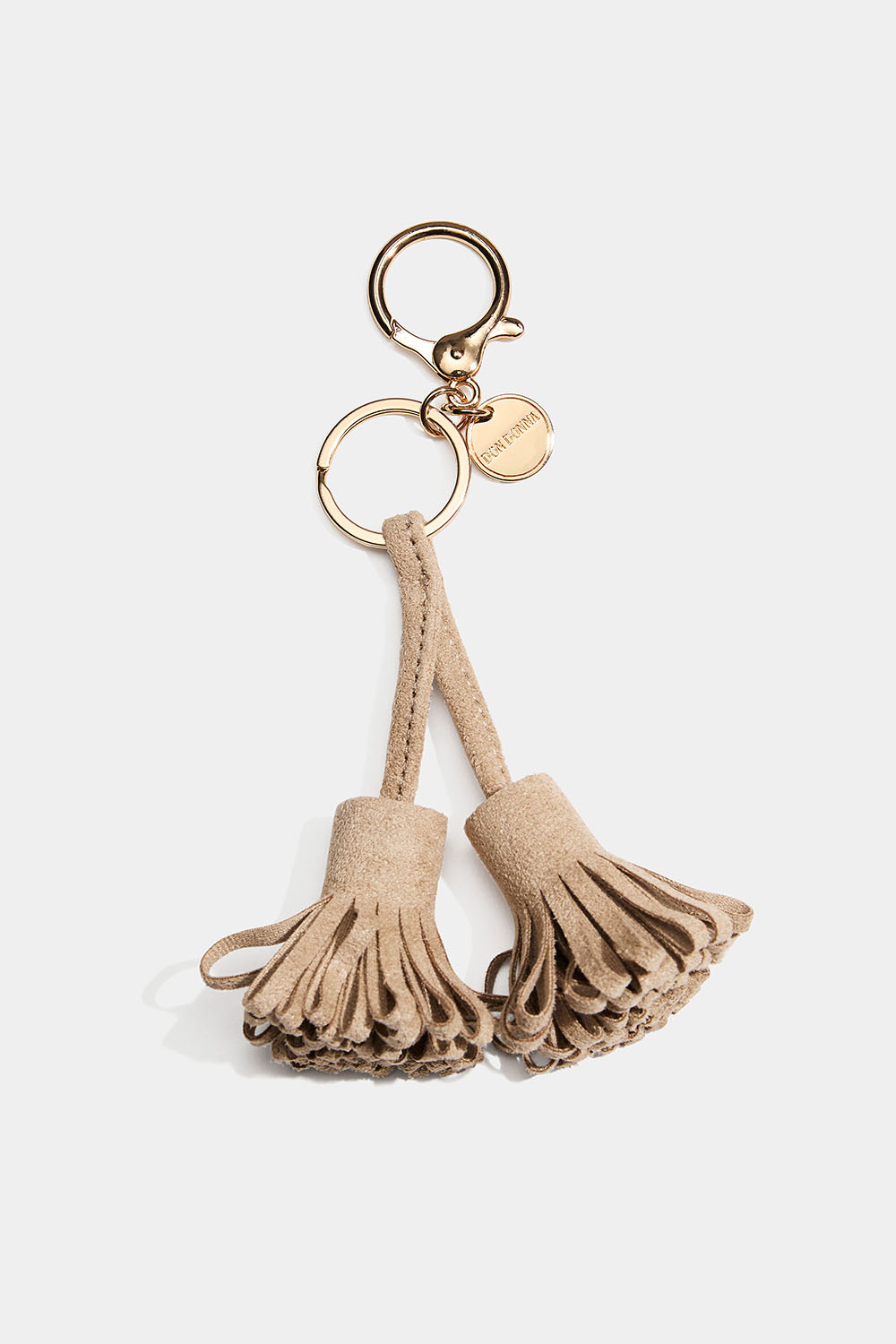 Taskedekoration med beige kvaster