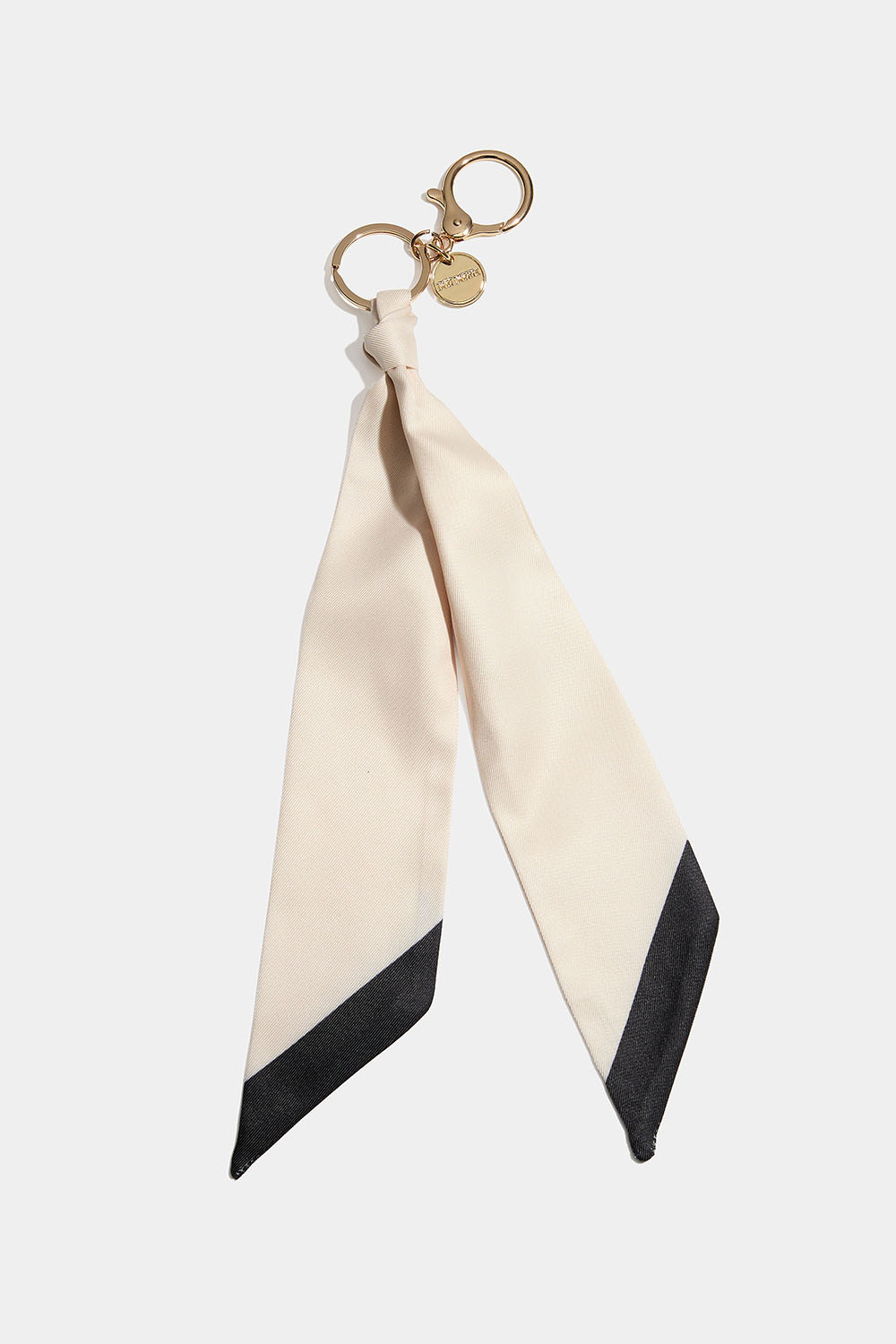 Taskedekoration med beige tørklæde