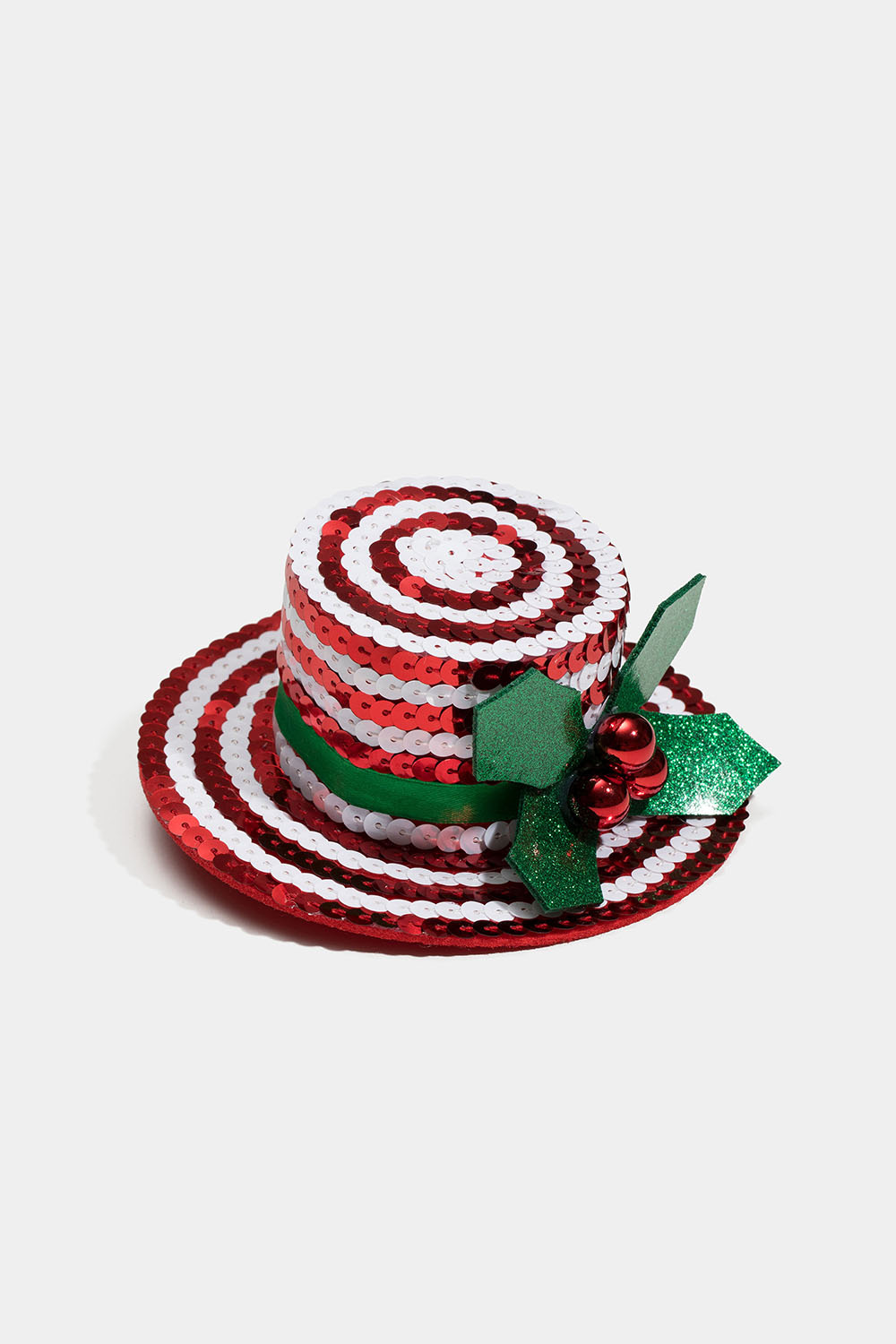 Hårspænde med en lille rød hat og mistelten