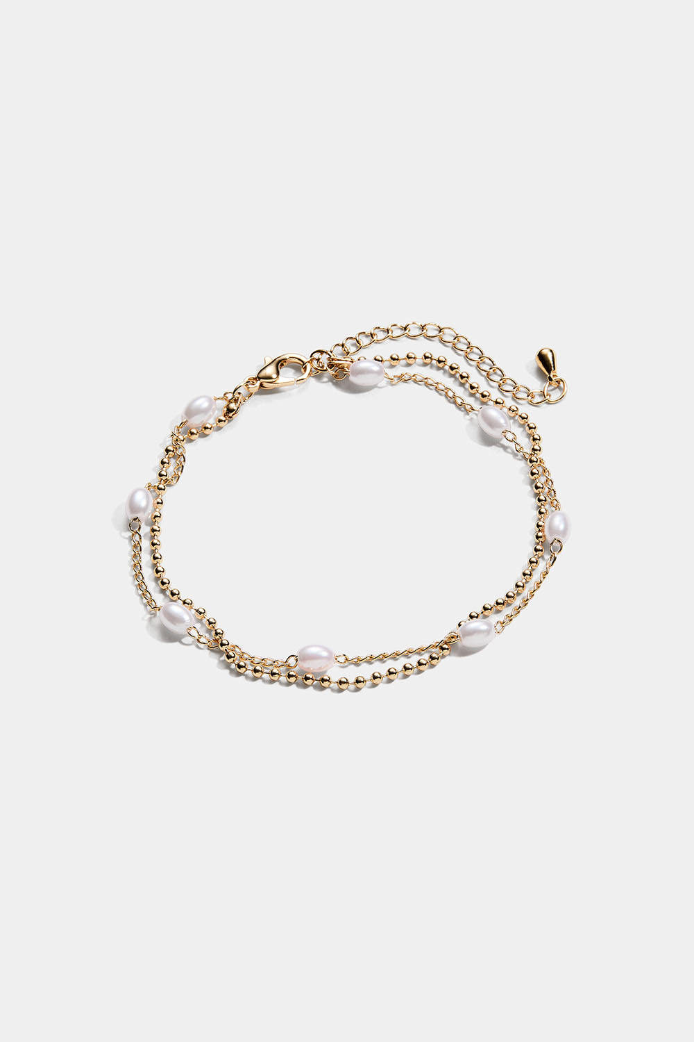 Guldfarvet dobbelt armbånd med ovale perler