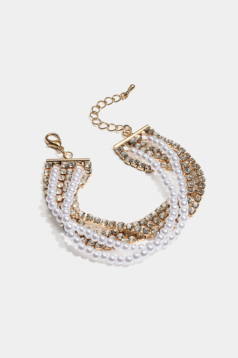 Bredt guldfarvet armbånd med led af similisten og perler