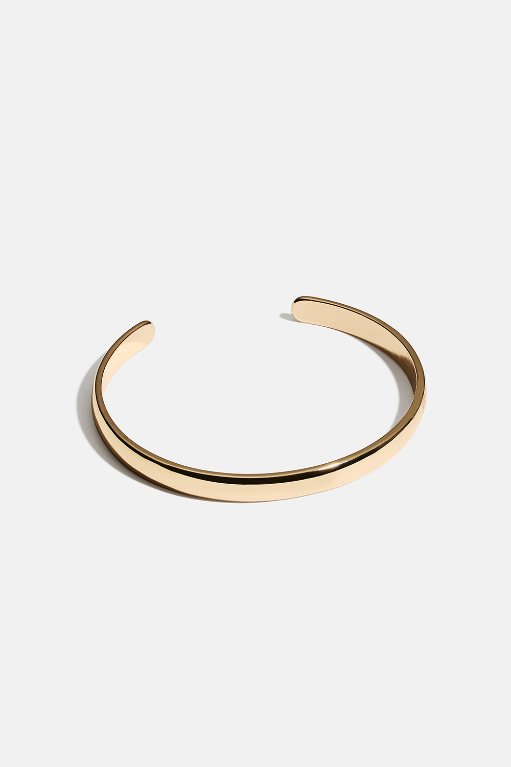 Smal guldfarvet armring