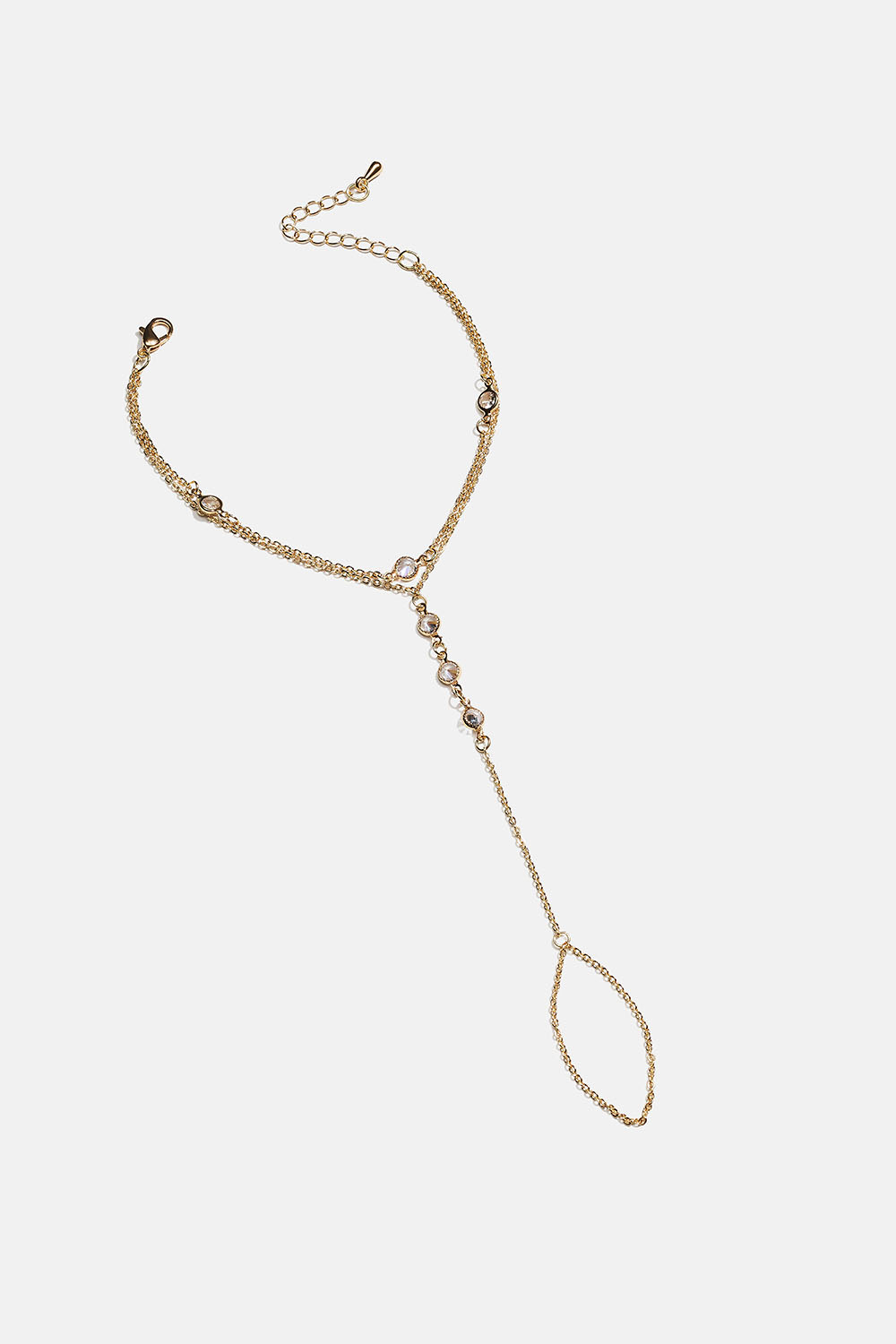 Guldfarvet armbånd med ring og glassten