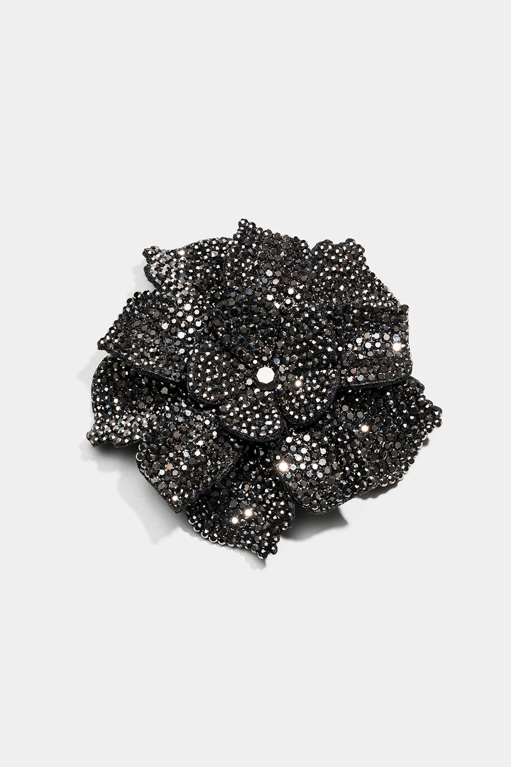 Stor broche med blomst og glassten