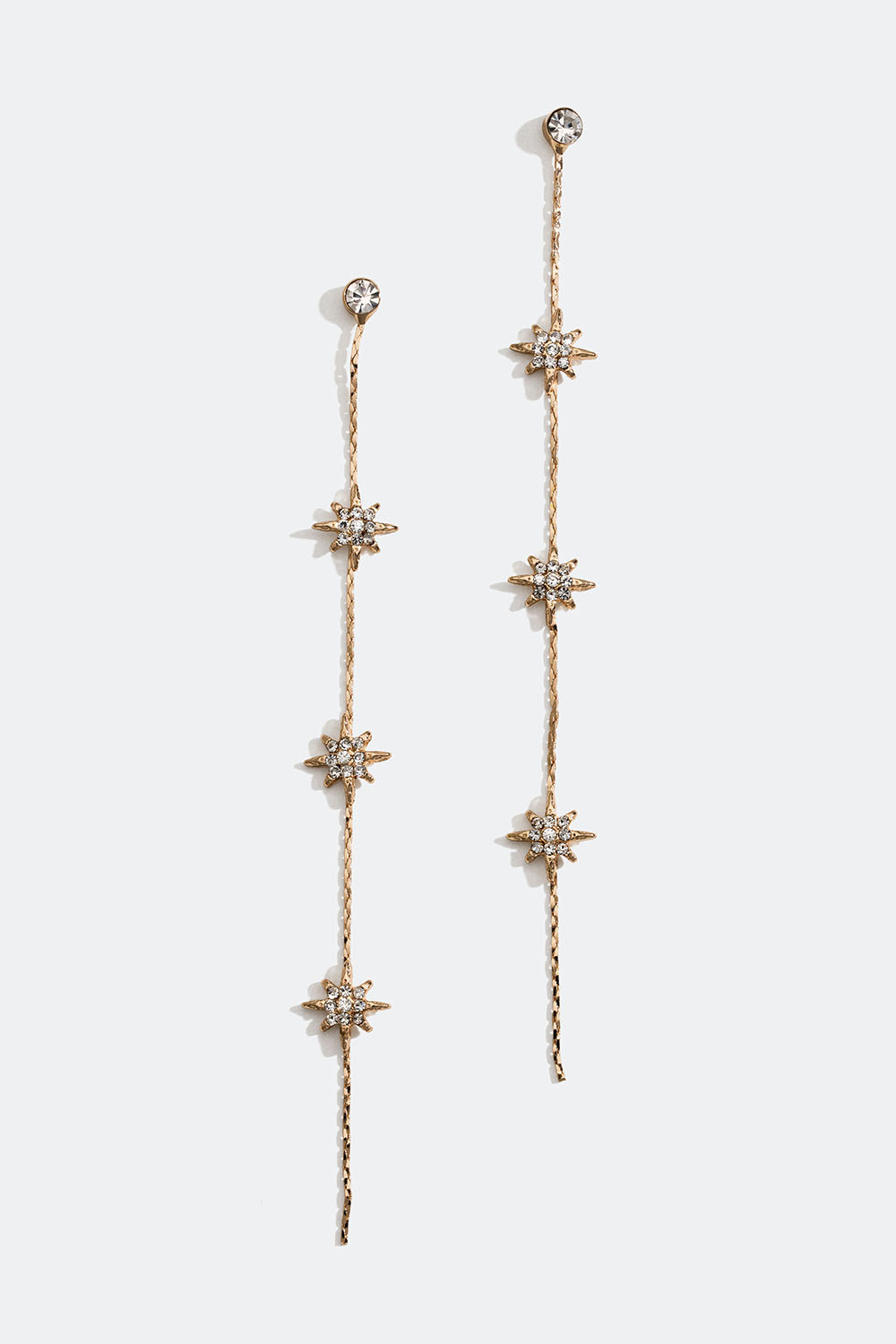 Lange guldfarvede kædeøreringe med stjerner og glassten