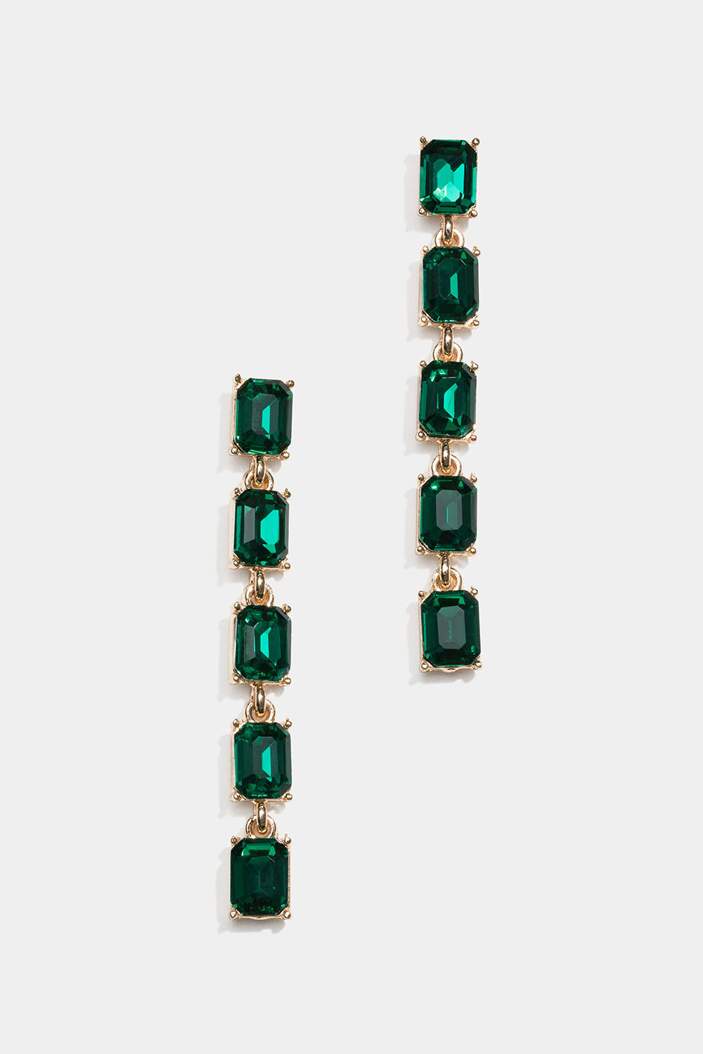 Lange guldfarvede øreringe med grønne glassten