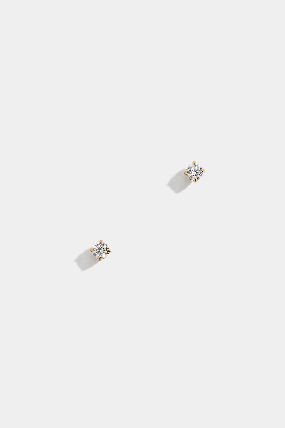 Mini-ørestikker i stål med 18 karat guld med kubisk zirkonia