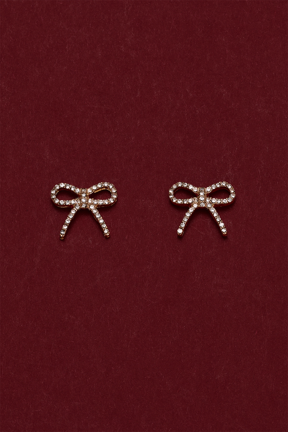 Guldfarvede sløjfeørestikker med rhinsten