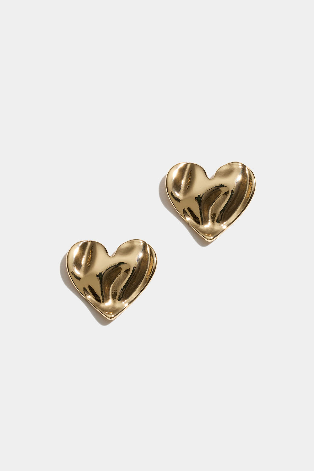 Guldfarvede hjertestikker med organisk tekstur
