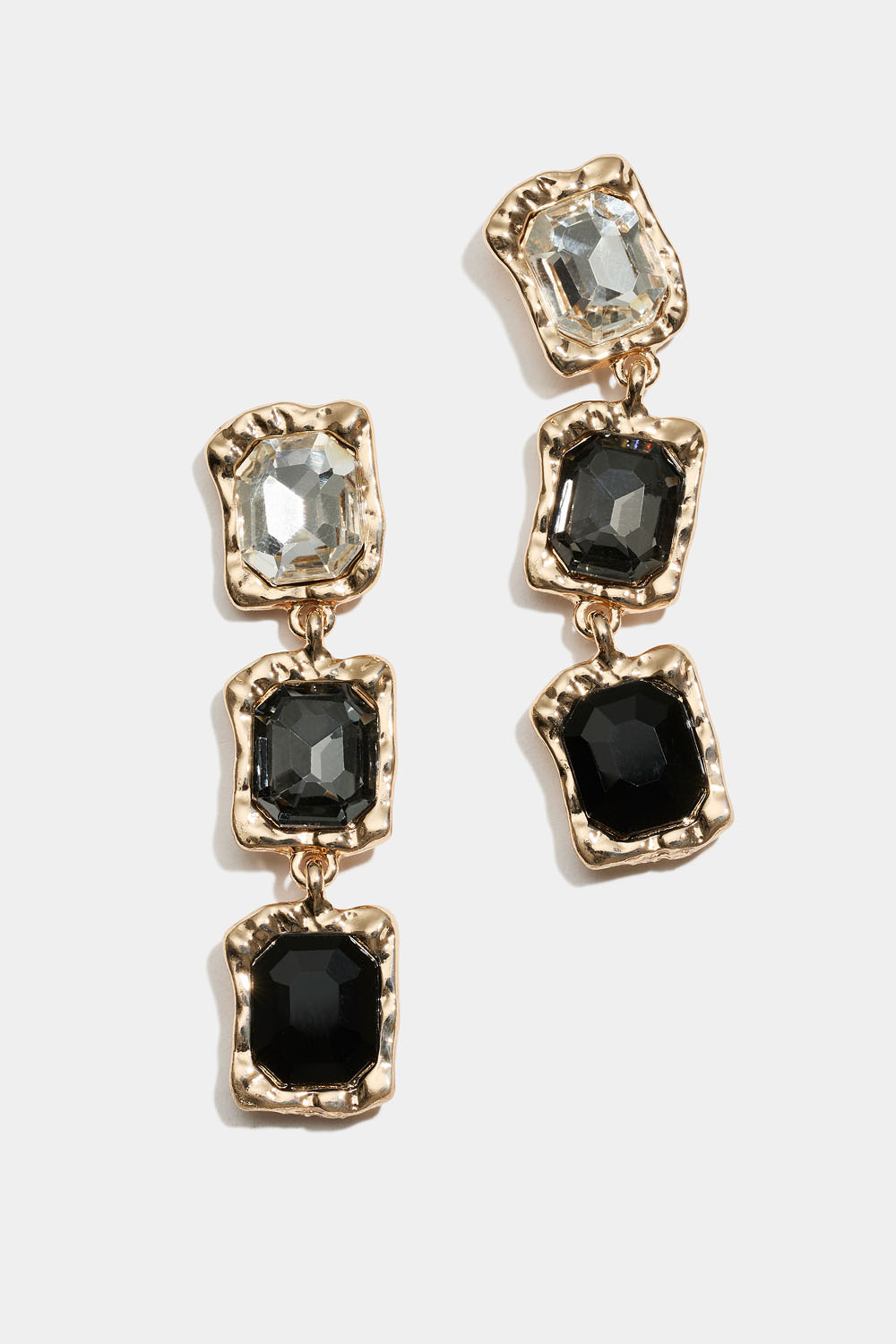 Øreringe med hvide, grå og sorte sten