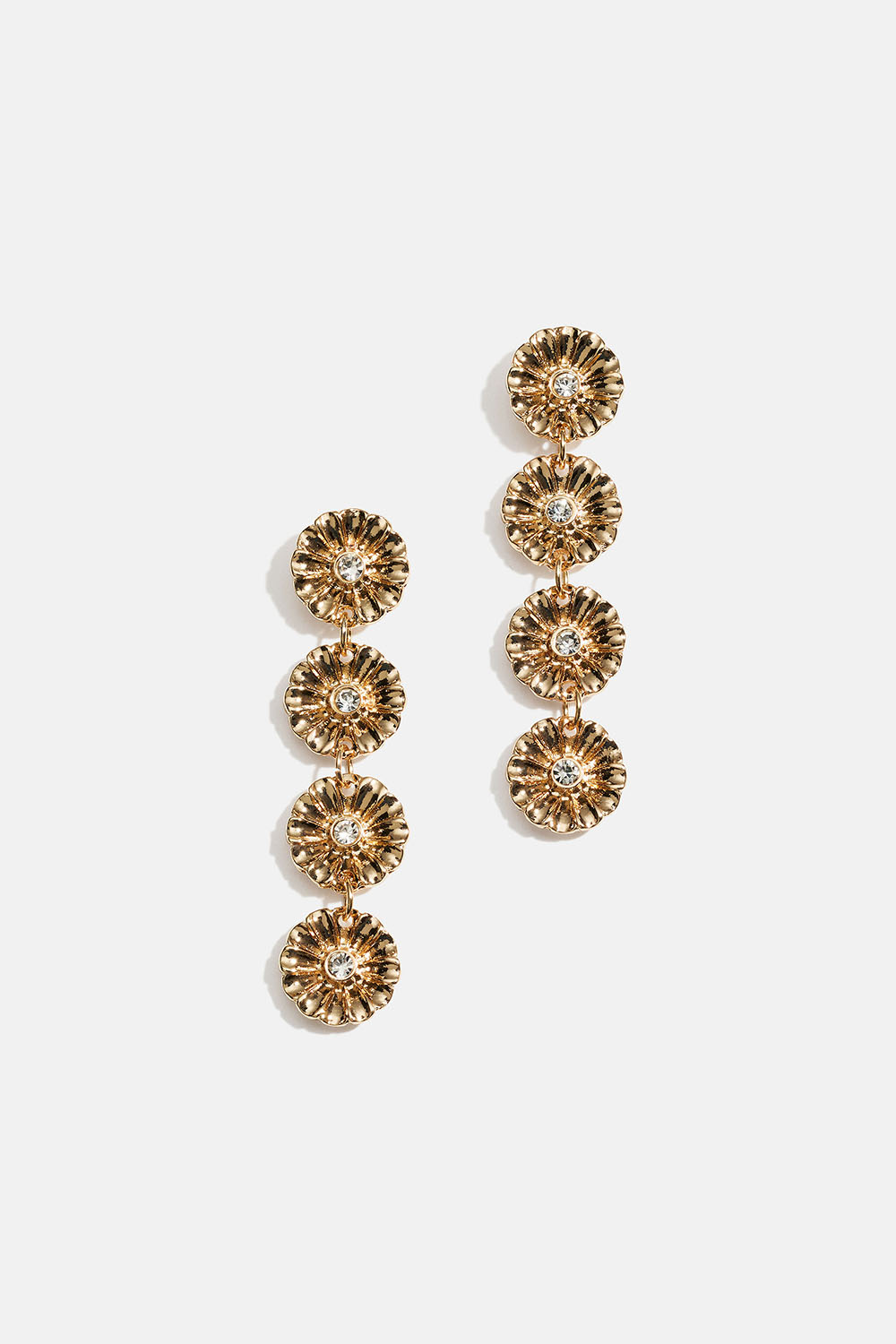 Lange guldfarvede øreringe med blomster og glassten