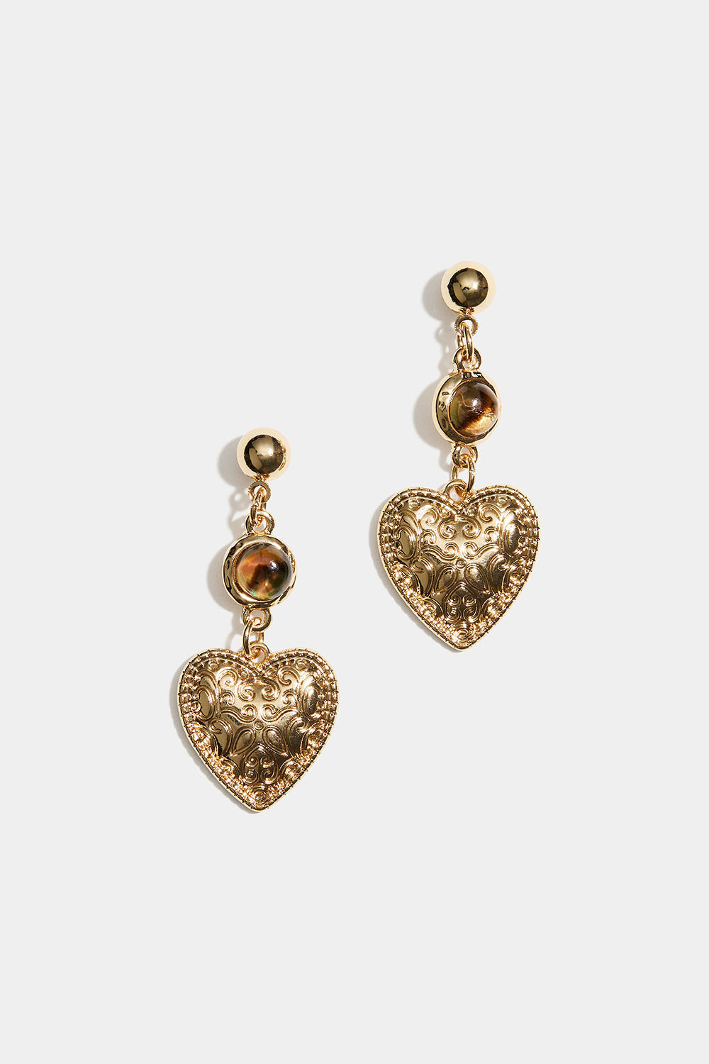 Øreringe med mønstrede hjerter og brune perler