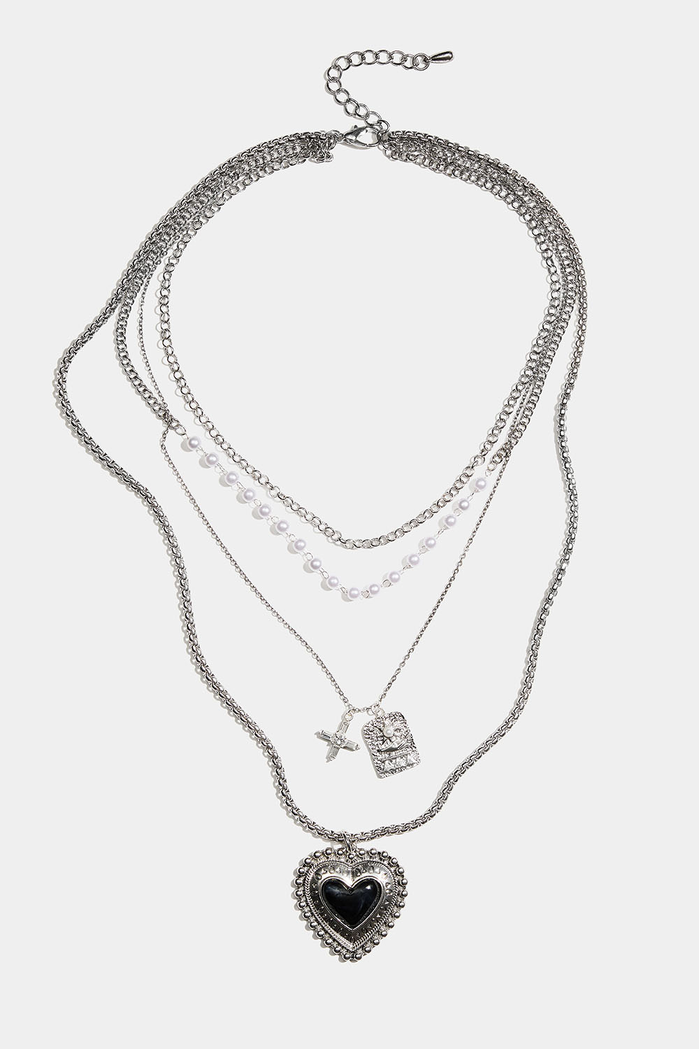 Lang halskæde med hjerte og forskellige kæder