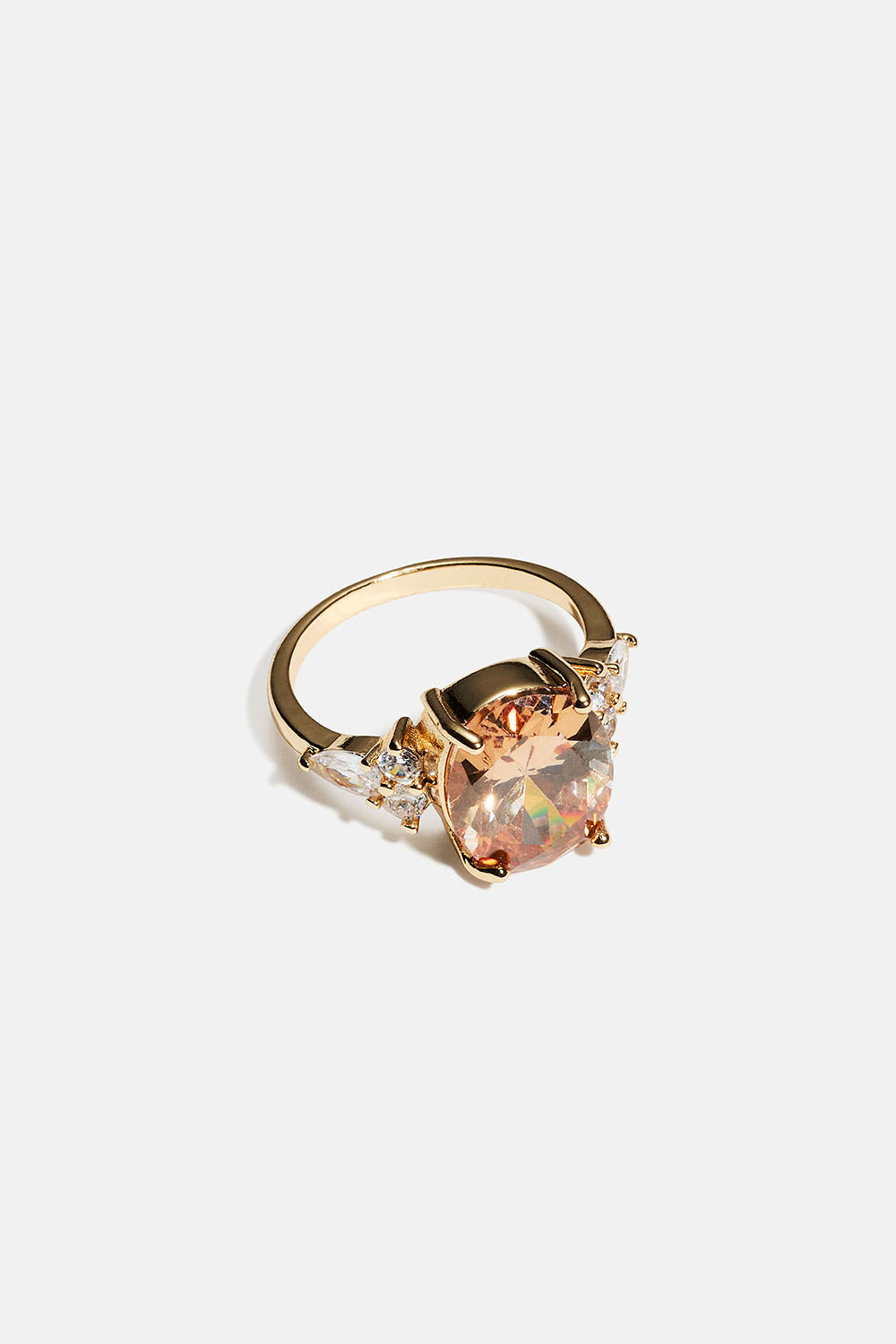 Guldfarvet ring med stor oval glassten