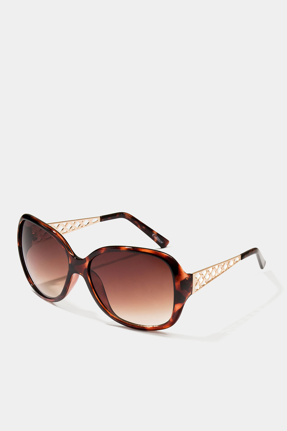 Solbriller, skildpadde og mønstret metal