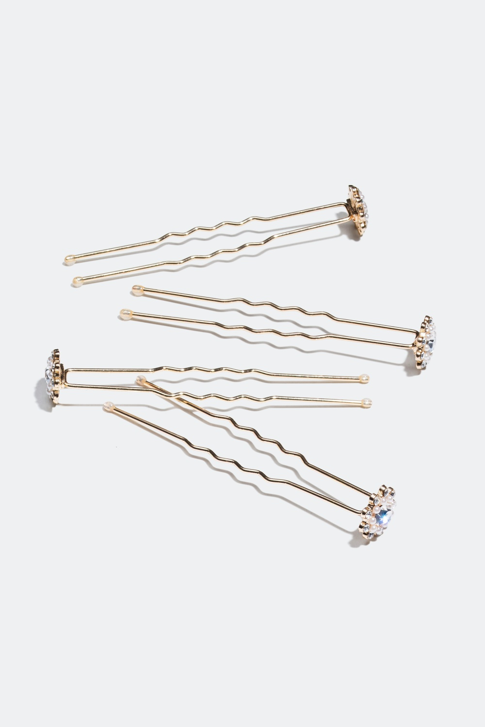 Guldfarvet hårnåle dekoreret med perle og sten