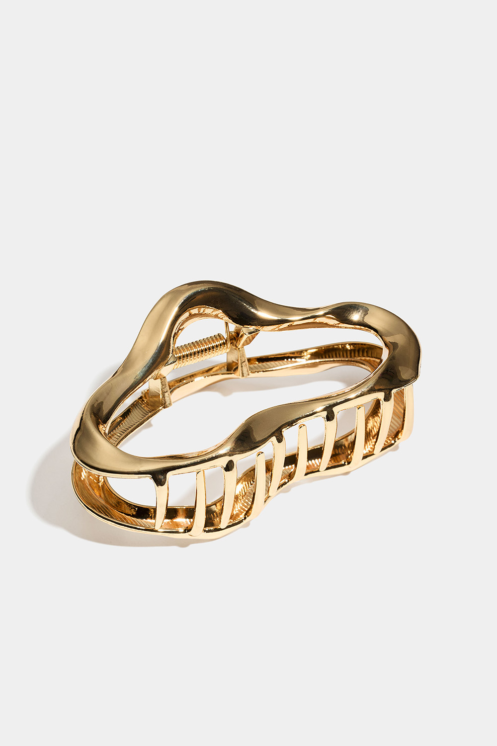 Guldfarvet hårspænde i organisk form