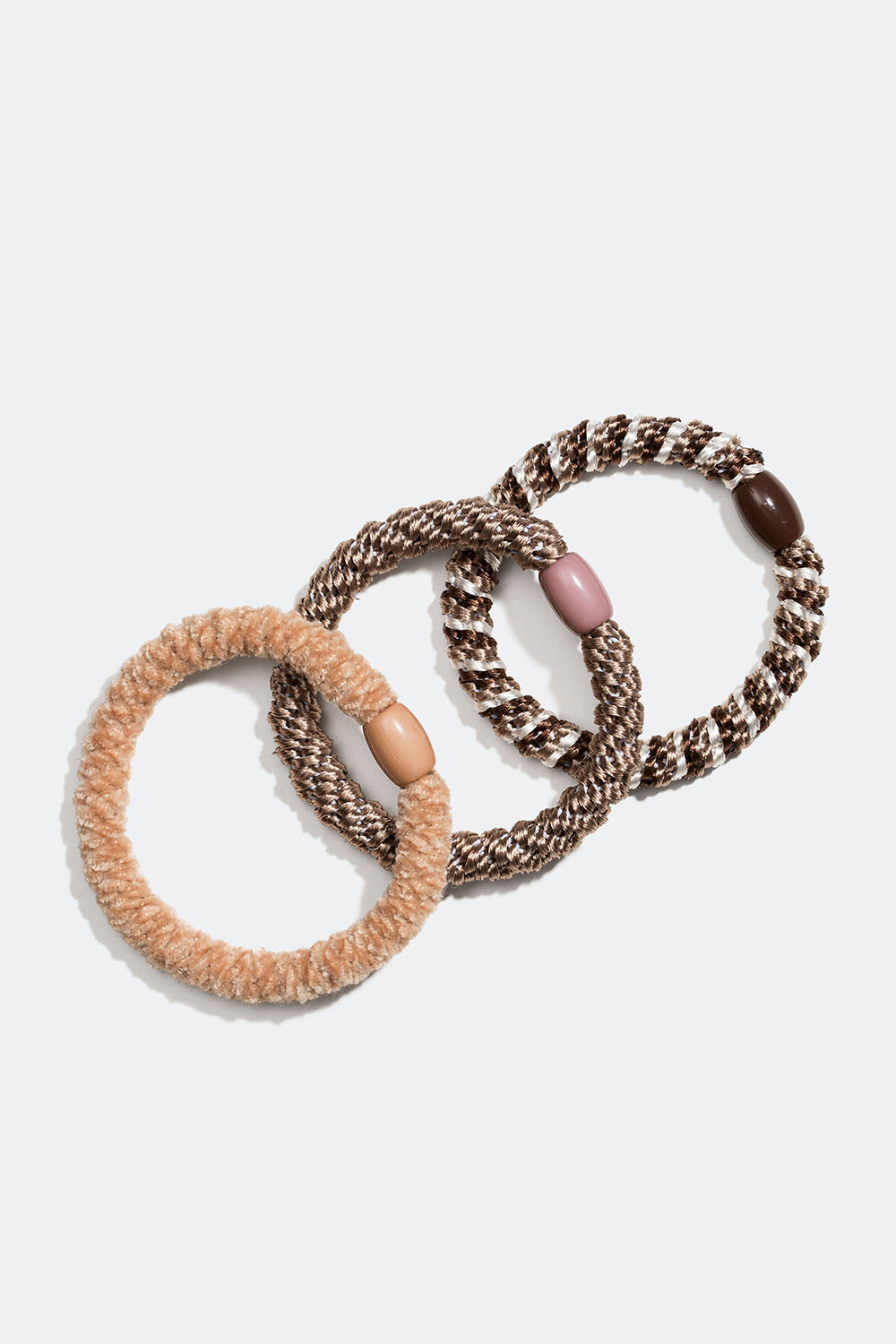 Blanding af flettede hårelastikker i beige og brun, 3-pak