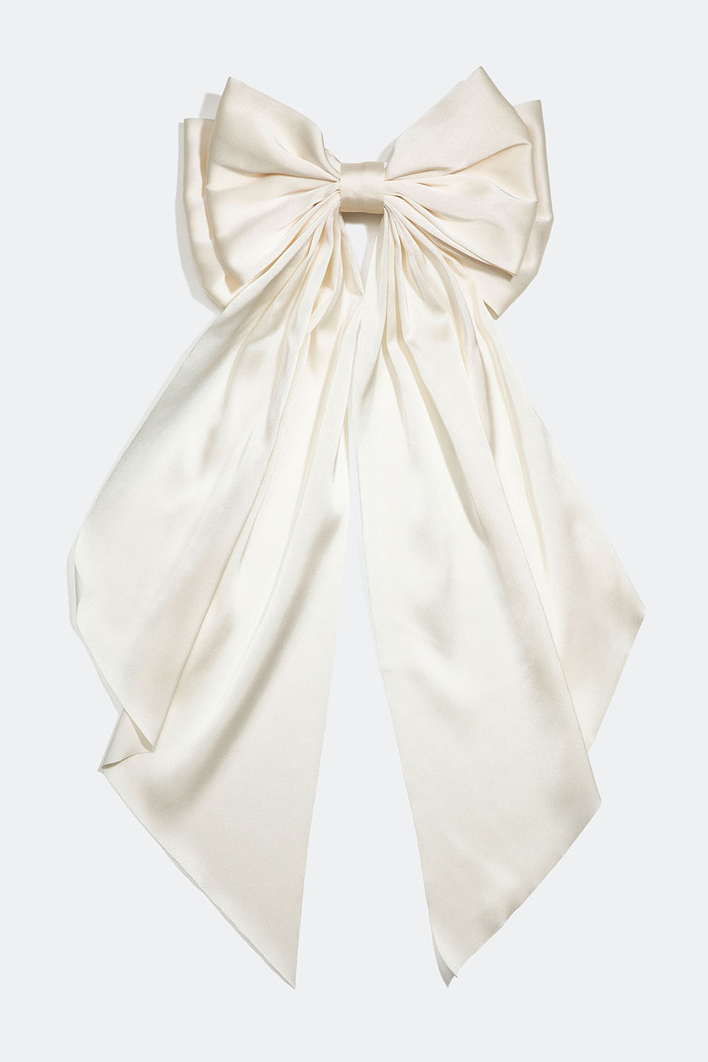 Hårspænde med stor hvid sløjfe i imiteret silke.