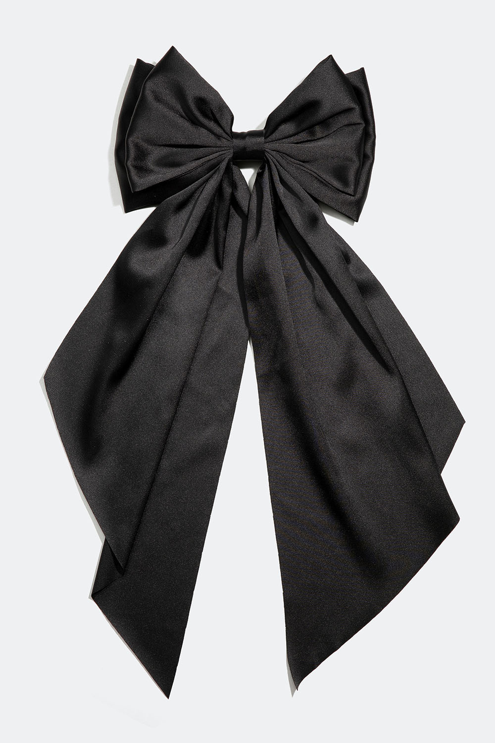 Hårspænde med stor sort sløjfe i imiteret silke.
