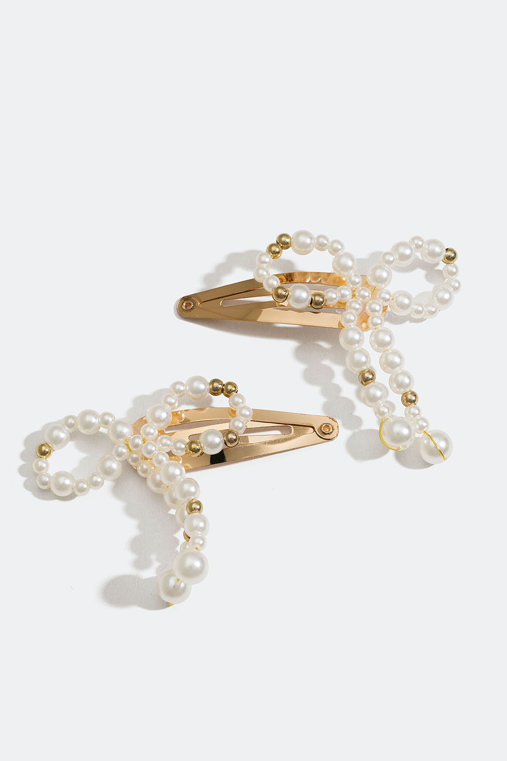 Guldfarvede hårspænder med sløjfe og perler, 2-pak