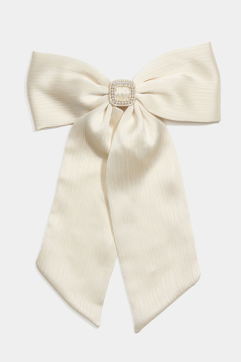Hårspænde med hvid sløjfe og rhinstenspynt