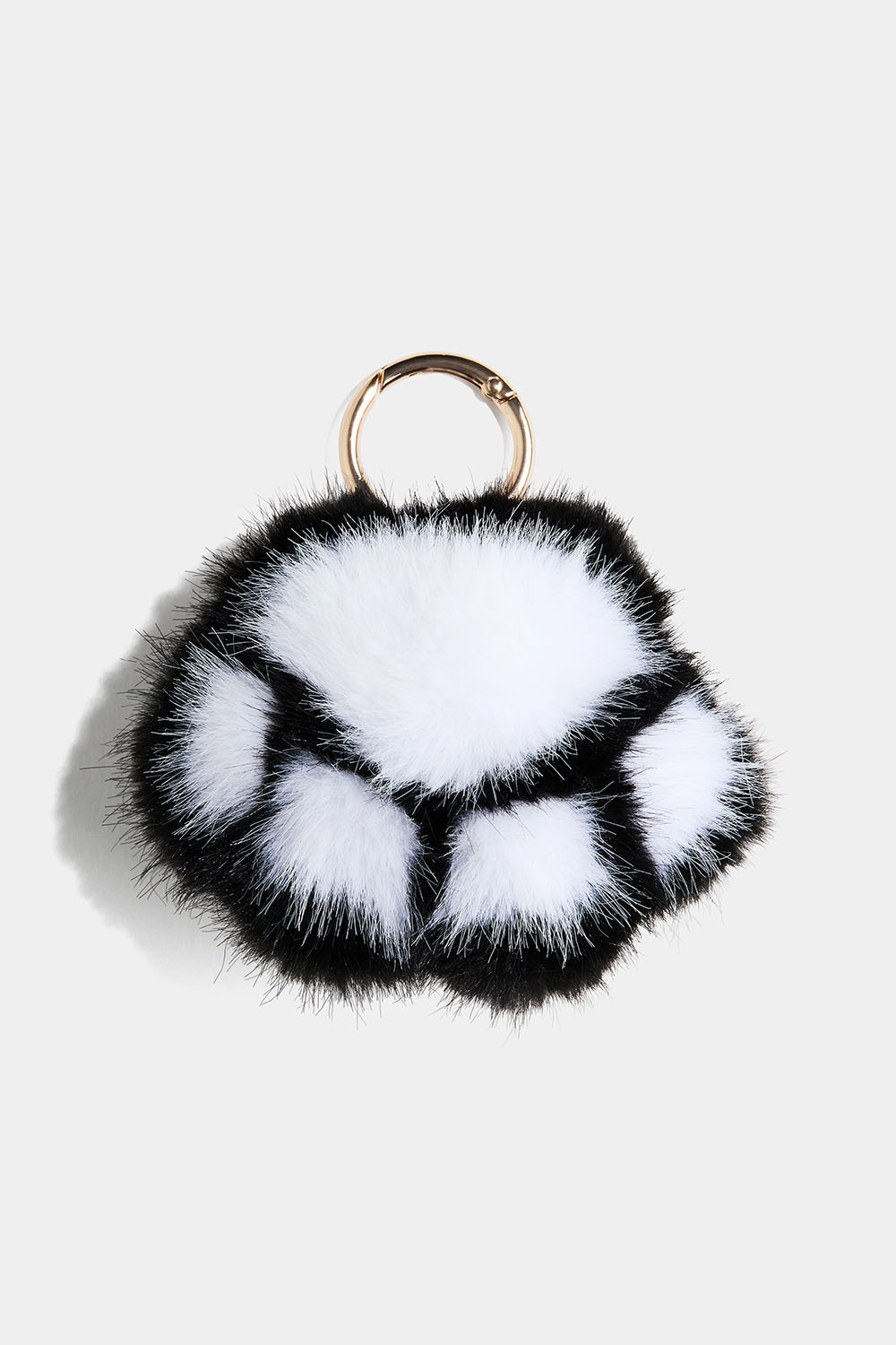 Fluffy pote-nøglering i sort og hvid